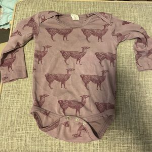 Kate Quinn purple llamas bodysuit